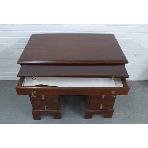 250 - Georgian mahogany kneehole desk, pull out slide over an arrangement of nine drawers, 89 x 80 x 53cm.