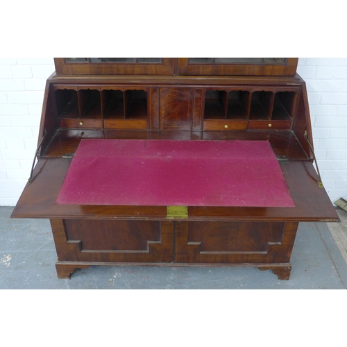 252 - Georgian mahogany bureau bookcase, the projecting cornice with a blind fret frieze over a pair of as... 