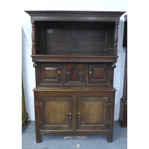 253 - Welsh oak Tridarn with canopied upper section, above three small doors, the base with a pair of pane... 