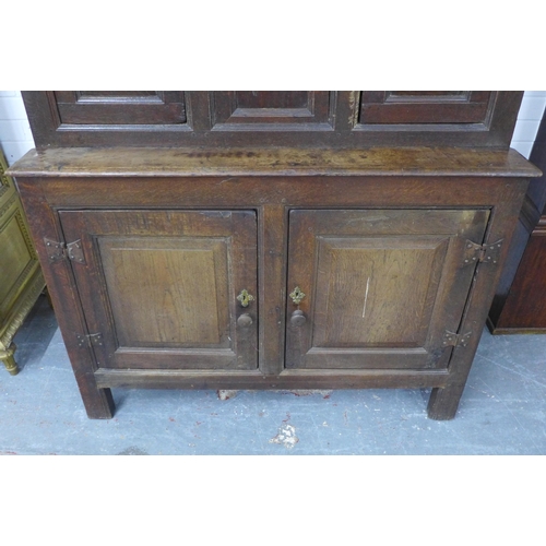 253 - Welsh oak Tridarn with canopied upper section, above three small doors, the base with a pair of pane... 