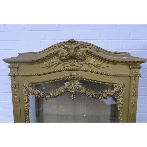 254 - Late 19th century gilt display cabinet with arched top and egg and dart frieze, glazed door with  wi... 