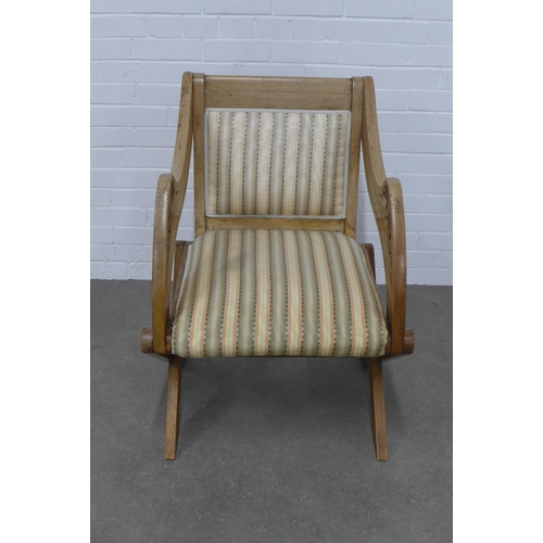 259 - Oak Glastonbury chair with carved arms, upholstered back and seat,  64 x 90 x 52cm.