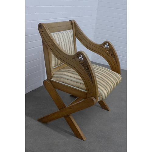 259 - Oak Glastonbury chair with carved arms, upholstered back and seat,  64 x 90 x 52cm.