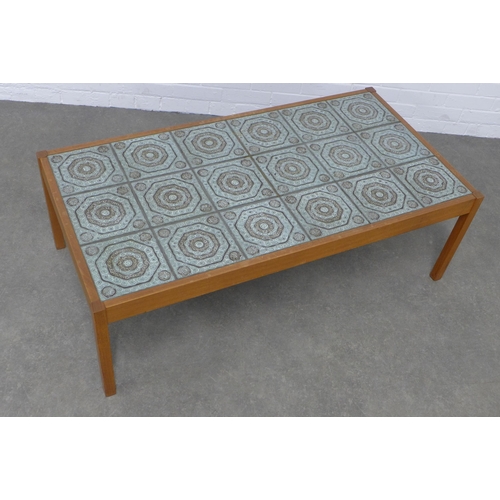 263 - A vintage teak and tiled top coffee table, 127 x 43 x 65cm.