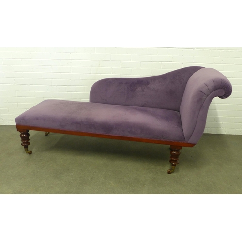 272 - Late 19th century chaise lounge upholstered in purple, on mahogany legs with brass caps and ceramic ... 