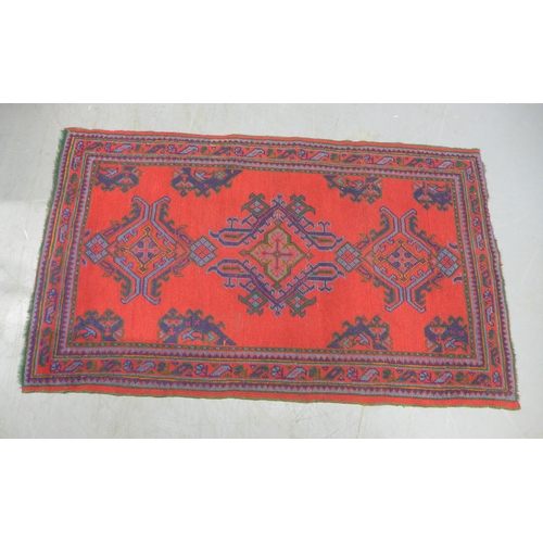 288 - Turkish rug with red field, 214 x 127cm.