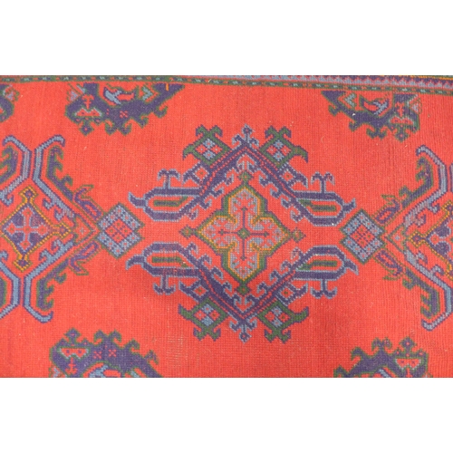 288 - Turkish rug with red field, 214 x 127cm.