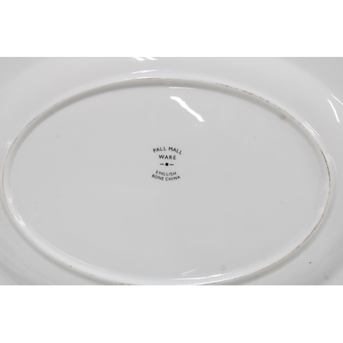 315 - Pall Mall Ware fish plates, 27cm, together with a serving dish (7)