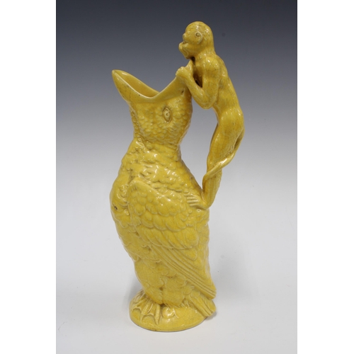 316 - Victorian style moulded jug, yellow glazed, in the form of a bird with open mouth and with a monkey ... 