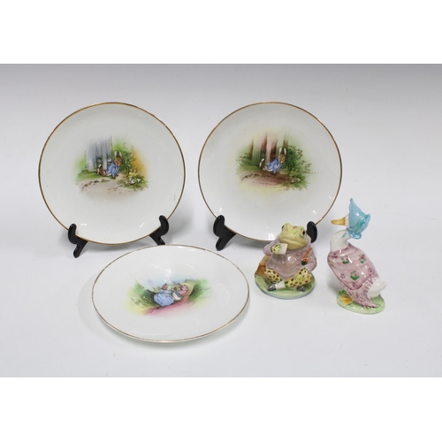 319 - Three Grimwades Peter Rabbit plates, 16cm, together with Beswick figures of Mr Jeremy Fisher and Jem... 