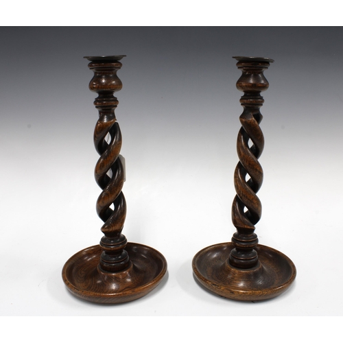 328 - Pair of oak barley twist candlesticks, 34cm (2)