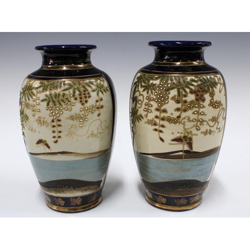 329 - Pair of Japanese earthenware baluster vases, 24cm (2)