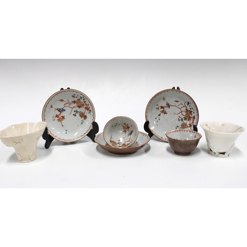 335 - Two Chinese cafe au lait cups and three saucers, internally decorated with birds and flowers, one cu... 