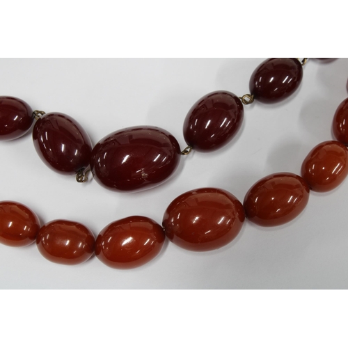 34 - Two faux cherry amber bead necklaces (2)