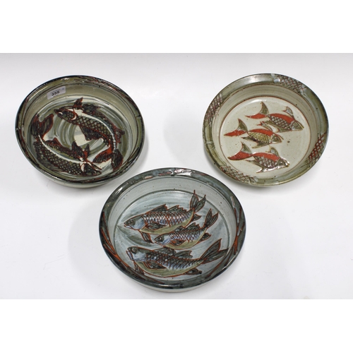 355 - Three Isabel Denyer studio pottery fish decorated dishes, 23cm diameter (3)