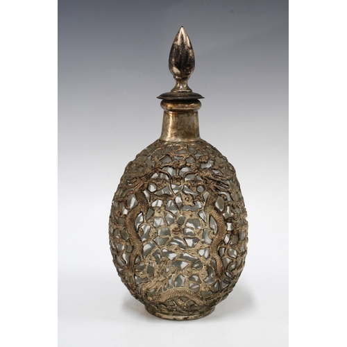 370 - Glass bottle in a white metal mount with dragons, 28cm