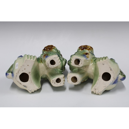 378 - A pair of pottery Foo dogs / lions, 22cm (2)