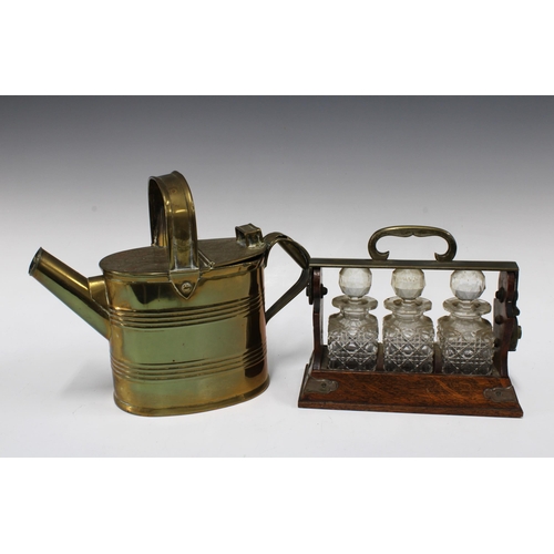 385 - Oak tantalus containing glass bottles, unusually small in size 22 x 19cm, together with a brass wate... 