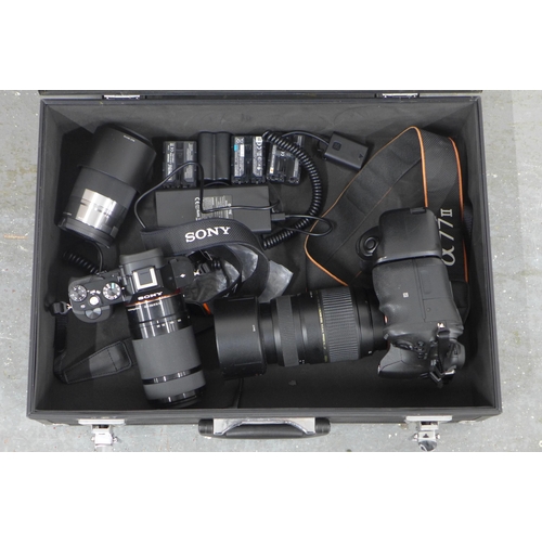 401 - Metal case containing a Sony A7R III and a Sony A77II, one extra lens and batteries, includes lenses... 