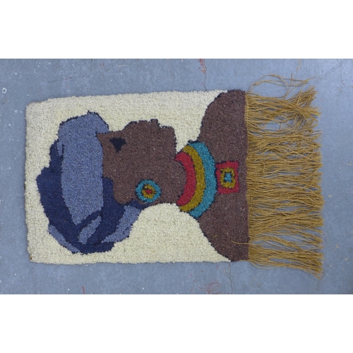 404 - Small kilim rug, 90 x 62cm, together with a wall hanging of a woman in a head wrap (2)