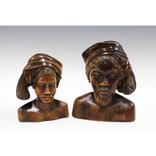 417 - Two Balinese style wooden busts, taller 25cm (2)