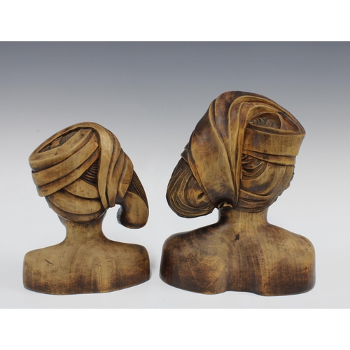 417 - Two Balinese style wooden busts, taller 25cm (2)