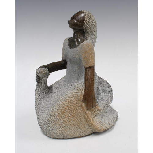 419 - Zimbabwean stoneware sculpture of a seated female, 26cm