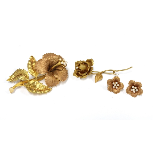 Vintage yellow metal orchid brooch with seed pearls, stamped 18k together with a pair of matching earrings and a small yellow metal rose brooch with a single pearl (3)