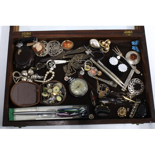 64 - Glazed showcase containing a quantity of costume and some silver jewellery, propelling pencils, and ... 