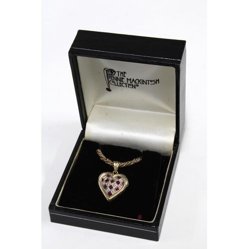 7 - 9ct gold diamond and ruby heart shaped pendant on a 9ct gold rope twist chain