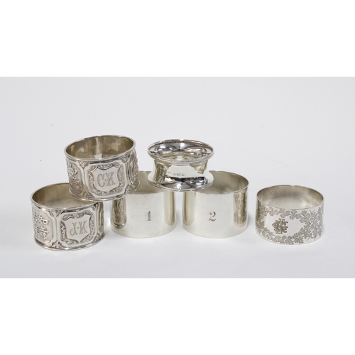 72 - Three silver napkin rings with various hallmarks, white metal napkin ring and two Chinese white meta... 