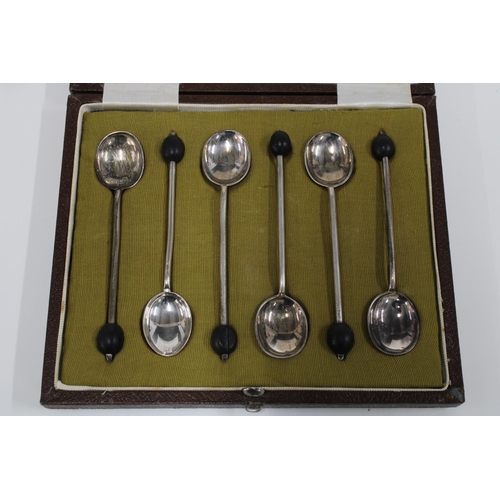 84 - Cased set of Edwardian silver coffee bean handled spoons, with one white metal replacement, and a ca... 