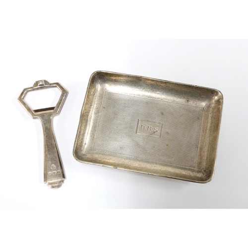 89 - Silver bottle opener, London 1951 and a Birmingham silver ashtray (2)