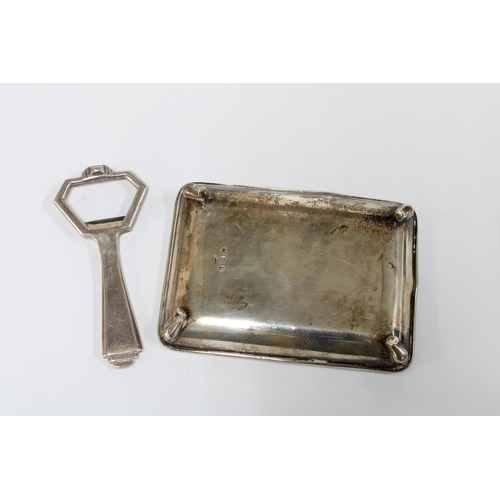 89 - Silver bottle opener, London 1951 and a Birmingham silver ashtray (2)