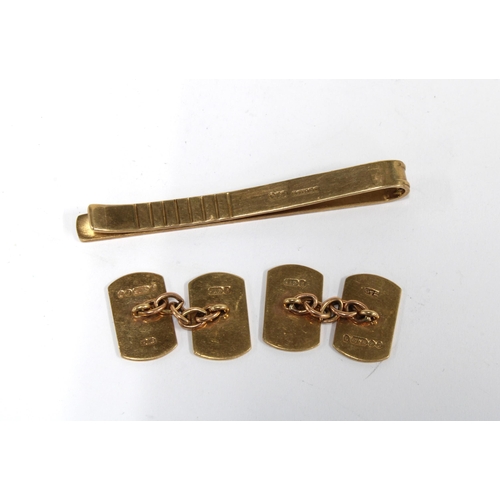 111 - A pair of 9ct gold cufflinks, London 1961 and a 9ct gold tiepin, Birmingham 1987 (2)