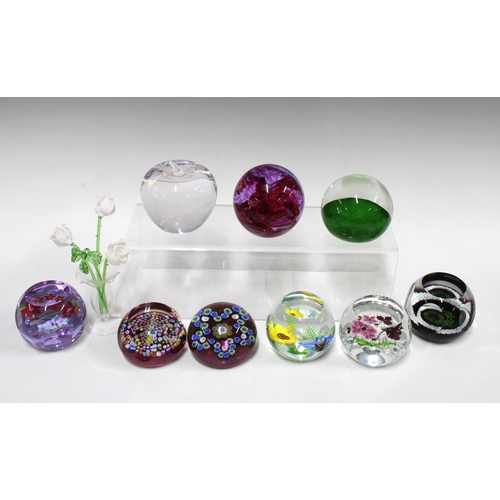 132 - Collection of paperweights, including a Caithness Scotland Christmas paperweight, three Caithness fl... 