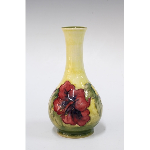 137 - Moorcroft pottery hibiscus pattern vase,  with Queen Mary paper label, 15cm