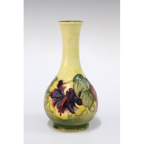 137 - Moorcroft pottery hibiscus pattern vase,  with Queen Mary paper label, 15cm