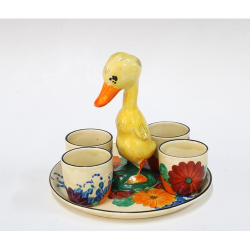 140 - Clarice Cliff Bizarre duck cruet stand in the Gayday pattern, with four Fantasque egg cups, 13cm