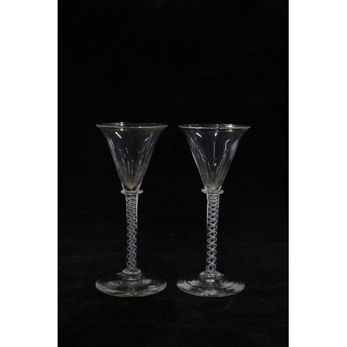 158 - Two 19th century opaque twist stem wine glasses, 14cm, together with an amber tinted Facon de Venise... 