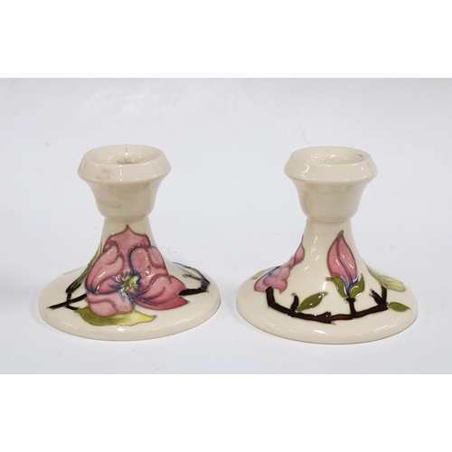 167 - Pair of Moorcroft Magnolia pattern candlesticks, 8cm (2)