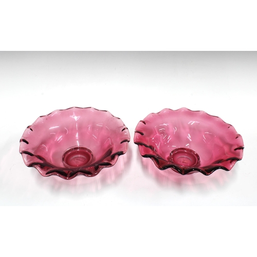 169 - Pair of cranberry glass bowls with frilled rims, and clear glass footrims, 23 x 18cm (2)