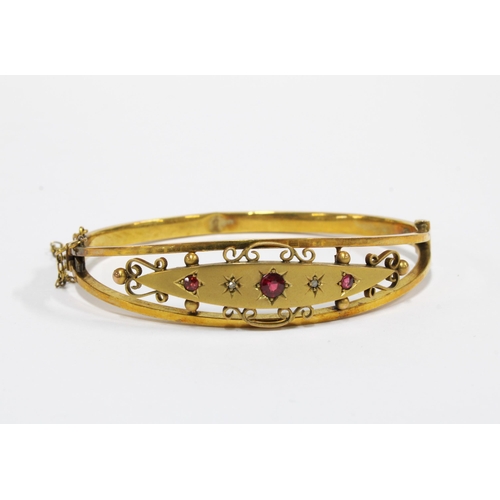 20 - Edwardian yellow metal and gemset bangle, unmarked