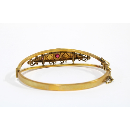 20 - Edwardian yellow metal and gemset bangle, unmarked