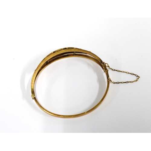 20 - Edwardian yellow metal and gemset bangle, unmarked