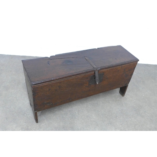 235 - Antique oak sword chest / coffer,  with hinged top and cut out end supports, 113 x 56 x 35cm.