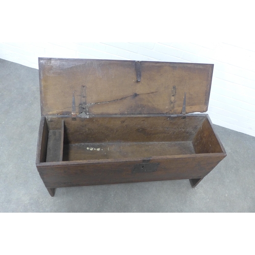 235 - Antique oak sword chest / coffer,  with hinged top and cut out end supports, 113 x 56 x 35cm.