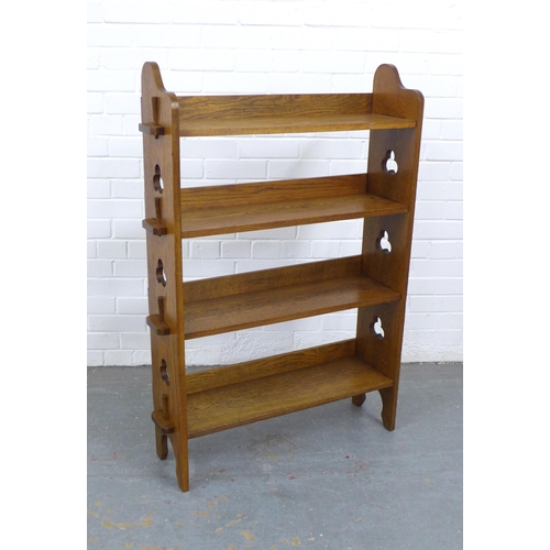 266 - A Liberty and Co Arts and Crafts oak open bookcase with plaque to the back, 83 x 117 x 25cm.