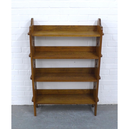 266 - A Liberty and Co Arts and Crafts oak open bookcase with plaque to the back, 83 x 117 x 25cm.