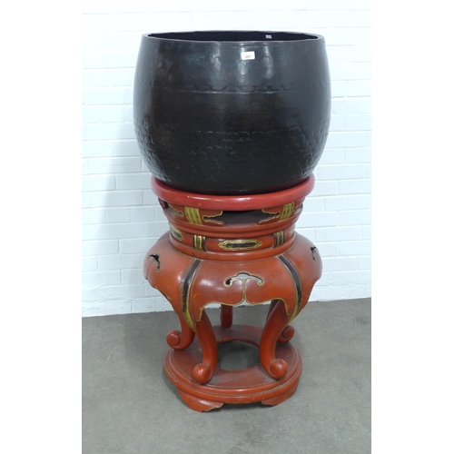 281 - A Buddhist bronze temple gong on a red lacquer and gilt decorated stand, on four scroll feet, 70 x 1... 